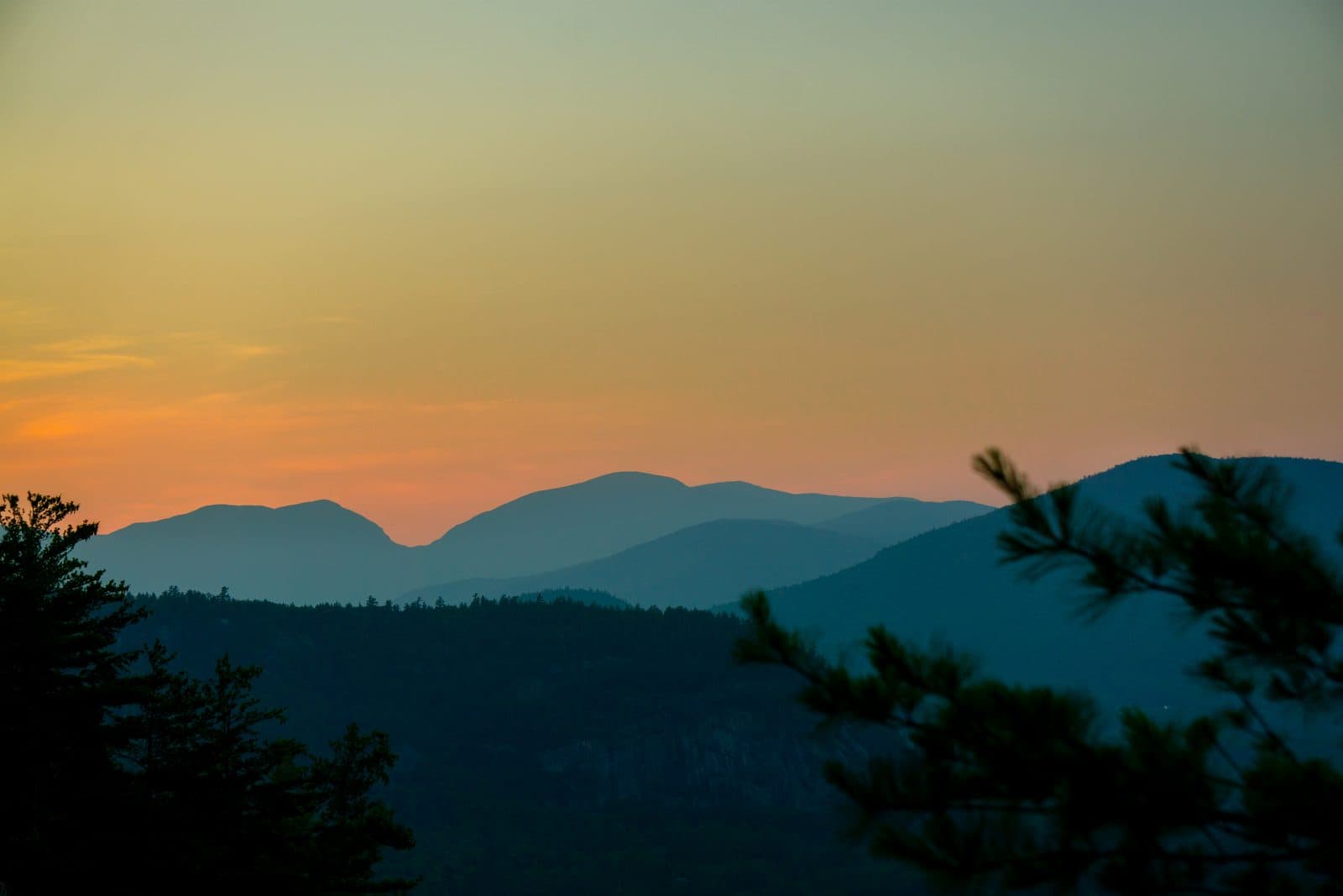 Layered mountain ridges at sunset